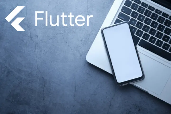 Flutter logo and text displayed next to a smartphone resting on a laptop keyboard, set against a dark stone surface background.