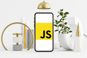 A smartphone displaying the JavaScript logo on a yellow background, surrounded by modern geometric decor and a green plant.
